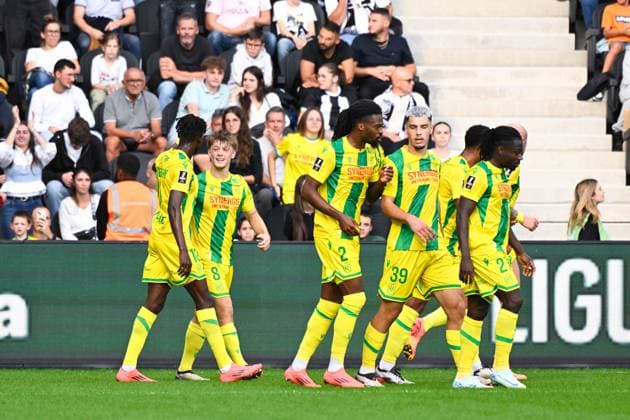 Johann Lepenant ( 8 - Nantes ) celebrates with teammates during the Ligue 1 match between Angers SCO and FC Nantes at Stade Raymond Kopa on September 22, 2024 in Angers, France. ( Photo by federico pestellini panoramic ) - FOOTBALL : Angers vs Nantes - Ligue 1 - 22 09 2024 FedericoPestellini Panoramic 