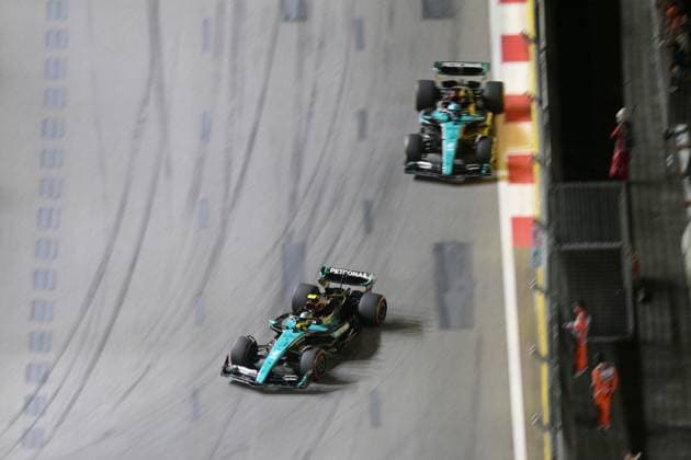 (240922) -- SINGAPORE, Sept. 22, 2024 -- Mercedes driver Lewis Hamilton (bottom) of Britain and his teammate George Russell of Britain compete during the Formula 1 Singapore Grand Prix night race at Marina Bay Street Circuit, Singapore, Sept. 22, 2024. (Photo by Xinhua) (SP)SINGAPORE-F1-SINGAPORE GRAND PRIX 2024 ThenxChihxWey 