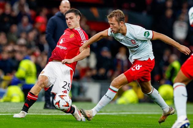 Manuel Ugarte of Manchester United, ManU passes the ball, defends by Michel Vlap of FC Twente , UEFA Europa League 2024 25 League Phase MD1, Manchester United v FC Twente, Old Trafford, September 25, 2024, Manchester, England.