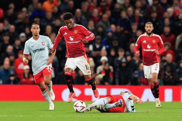 Manchester United, ManU v FC Twente Europa League 25 09 2024. Amad Diallo (16) of Manchester United is tackled by Youri Regeer (8) of FC Twente during the Europa League match between Manchester United and FC Twente at Old Trafford, Manchester, England on 25 September 2024. Manchester Old Trafford Greater Manchester England Editorial use only , Copyright: xConorxMolloyx PSI-20476-0021