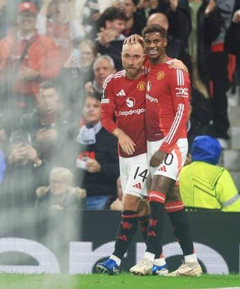 Christian Eriksen of Manchester United, ManU celebrates scoring the opening goal with Marcus Rashford Manchester United v FC Twente, UEFA Europa League, Group Stage, Football, Old Trafford, Manchester, UK, 25 Sep 2024 EDITORIAL USE ONLY No use with unauthorised audio, video, data, fixture lists, club league logos or live services. Online in-match use limited to 120 images, no video emulation. No use in betting, games or single club league player publications. Copyright: xMattxWest Shutterstockx 14735174ag
