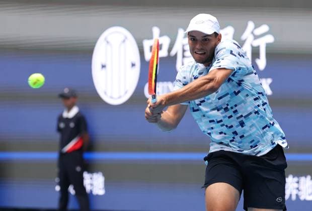 (240926) -- BEIJING, Sept. 26, 2024 -- Pavel Kotov of Russia hits a return during the men s singles first round match against Zhou Yi of China at 2024 China Open tennis tournament in Beijing, China, Sept. 26, 2024. ) (SP)CHINA-BEIJING-TENNIS-CHINA OPEN-MEN S SINGLES-FIRST ROUND (CN) ZhangxChen 