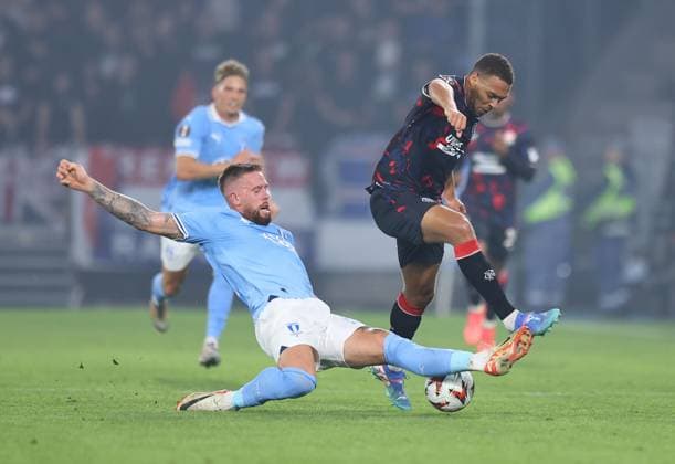 Cyriel Dessers of Rangers competes for the ball with Pontus Jansson of Malmo Malmo v Rangers, UEFA Europa League, Group Stage, Football, Eleda Stadion, Malmo, Sweden, 26 Sep 2024 EDITORIAL USE ONLY No use with unauthorised audio, video, data, fixture lists, club league logos or live services. Online in-match use limited to 120 images, no video emulation. No use in betting, games or single club league player publications. Copyright: xMichaelxZemanek Shutterstockx 14739047w
