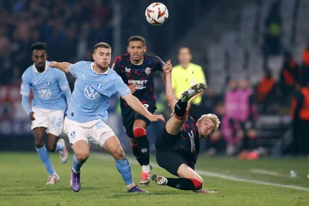 Malmö s Gabriel Busanello and Ranger s Ross McCausland fighting for the ball during the Europa League football match between Malmö FF and Rangers FC at Malmö New Stadium in Malmo, Sweden September 26, 2024. MALMÖ SVERIGE ttexport x10600x