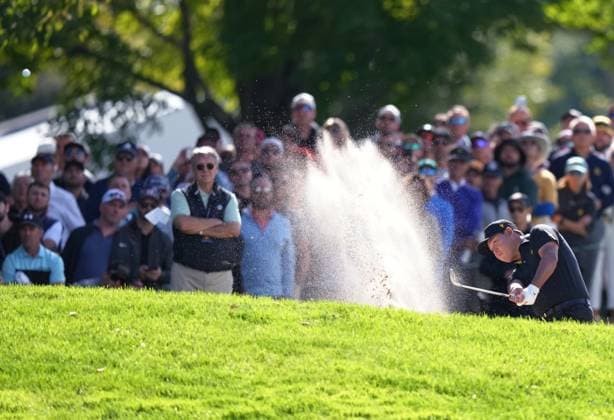 September 27, 2024, Montreal, Pq, Canada: International team member Si Woo Kim of South Korea, hits out of the bunker on the 3rd hole during the second round foursome match at the Presidents Cup golf tournament at Royal Montreal Golf Club in Montreal, Friday, Sept. 27, 2024. Golf 2024: Presidents Cup: Round Two  - ZUMAc35_ 20240927_zaf_c35_071 Copyright: xNathanxDenettex