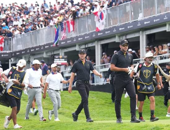September 27, 2024, Montreal, Pq, Canada: International team members Corey Conners of Canada, and Mackenzie Hughes of Canada, walk off the first tee during second round foursome match at the Presidents Cup golf tournament at Royal Montreal Golf Club in Montreal, Friday Sept. 27, 2024. Corey Conners, Mackenzie Hughes, Wyndham Clark, Tony Finau - ZUMAc35_ 20240927_zaf_c35_155 Copyright: xNathanxDenettex