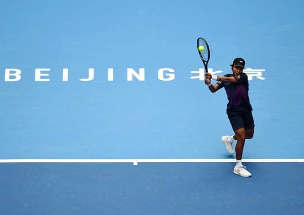 (240928) -- BEIJING, Sept. 28, 2024 -- Mananchaya Sawangkaew of Thailand returns a shot during the women s singles second round match between Aryna Sabalenka of Belarus and Mananchaya Sawangkaew of Thailand at 2024 China Open tennis tournament in Beijing, capital of China, Sept. 28, 2024. ) (SP)CHINA-BEIJING-TENNIS-CHINA OPEN-WOMEN S SINGLES-SECOND ROUND (CN) ZhangxChenlin 