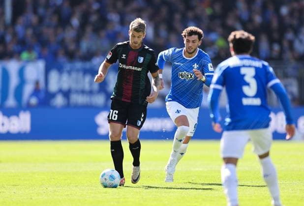 28.09.2024, xdcx, Fussball 2. Bundesliga, SV Darmstadt 98 - 1. FC Magdeburg, emonline, emspor, despor, v.l., Marcus Mathisen (1. FC Magdeburg), Fraser Hornby (SV Darmstadt 98) DFL DFB REGULATIONS PROHIBIT ANY USE OF PHOTOGRAPHS AS IMAGE SEQUENCES AND OR QUASI-VIDEO.