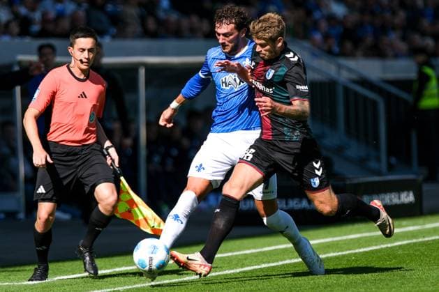 Fraser Hornby (SV Darmstadt 98, 09) im Zweikampf mit Marcus Mathisen (1. FC Magdeburg, 16), GER, SV Darmstadt 98 vs. 1. FC Magdeburg, Fussball, 2. Bundesliga, 7. Spieltag, Saison 2024 2025, 28.09.2024. DFL REGULATIONS PROHIBIT ANY USE OF PHOTOGRAPHS as IMAGE SEQUENCES and or QUASI-VIDEO. GER, SV Darmstadt 98 vs. 1. FC Magdeburg, Fussball, 2. Bundesliga, 7. Spieltag, Saison 2024 2025, 28.09.2024. Darmsatdt