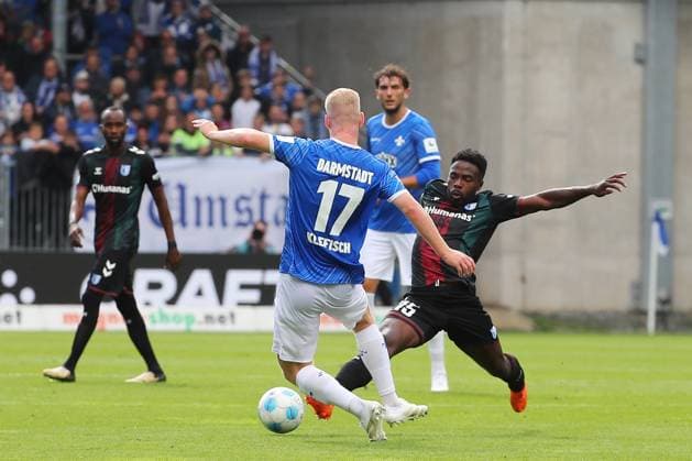 28.09.2024, xtvx, Fussball 2.Bundesliga, SV Darmstadt 98 - 1.FC Magdeburg emspor, v.l. Zweikampf, Duell, duel, tackle, compete Kai Klefisch (SV Darmstadt 98) Daniel Heber (1. FC Magdeburg) (DFL DFB REGULATIONS PROHIBIT ANY USE OF PHOTOGRAPHS as IMAGE SEQUENCES and or QUASI-VIDEO) Darmstadt