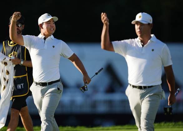 September 28, 2024, Montreal, Pq, Canada: International team member Tom Kim of South Korea, left, and International team member Si Woo Kim of South Korea, celebrate after a birdie on the 11th hole during their fourth round foursomes match at the Presidents Cup golf tournament at Royal Montreal Golf Club, in Montreal, Saturday, Sept. 28, 2024. Tom Kim, - ZUMAc35_ 20240928_zaf_c35_144 Copyright: xNathanxDenettex