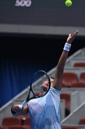(240929) -- BEIJING, Sept. 29, 2024 -- Bu Yunchaokete serves during the men s singles second round match between Bu Yunchaokete of China and Lorenzo Musetti of Italy at 2024 China Open tennis tournament in Beijing, capital of China, Sept. 29, 2024. ) (SP)CHINA-BEIJING-TENNIS-CHINA OPEN-MEN S SINGLES (CN) ZhangxLong 