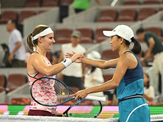 (240929) -- BEIJING, Sept. 29, 2024 -- Zhang Shuai (R) greets Greet Minnen after the women s singles third round match between Zhang Shuai of China and Greet Minnen of Belgium at 2024 China Open tennis tournament in Beijing, capital of China, Sept. 29, 2024. ) (SP)CHINA-BEIJING-TENNIS-CHINA OPEN-WOMEN S SINGLES (CN) ZhangxLong 