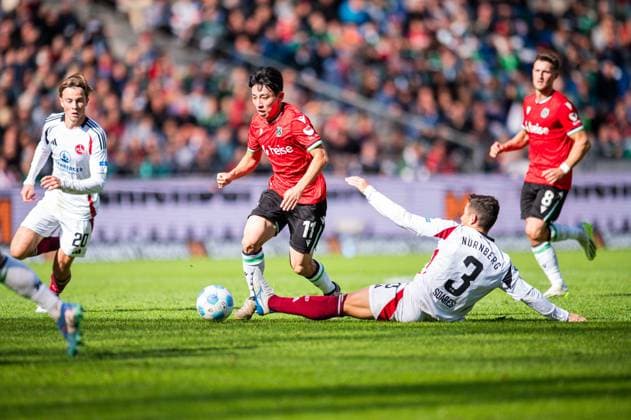 29.09.2024 - Fußball, 2024 2025, 2. Bundesliga, 7. Spieltag, Hannover 96 - 1. FC Nürnberg: (L-R) Hyun-ju Lee (Hannover), Danilo Soares (Nürnberg) DFL REGULATIONS PROHIBIT ANY USE OF PHOTOGRAPHS AS IMAGE SEQUENCES AND OR QUASI-VIDEO.