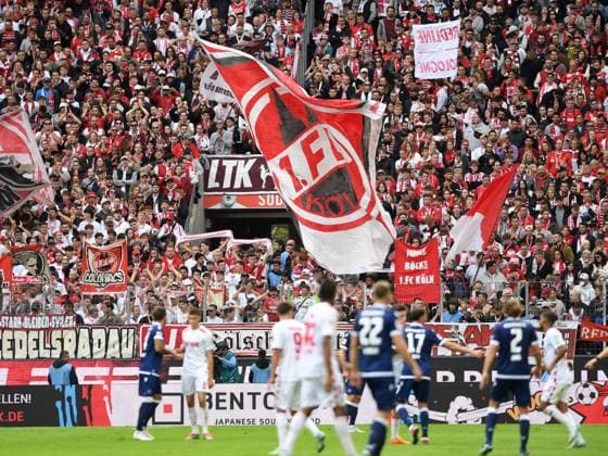 Fans 1. FC Koeln mit Flaggen Bannern waehrend des Spiels der 2. Bundesliga zwischen 1. FC Köln und Karlsruher SC im RheinEnergieStadion am 29. September 2024 in Köln, Deutschland. (Foto von Ralf Treese DeFodi Images) +++ Fans 1. FC Koeln with flags banner during the 2. Bundesliga match between 1. FC Köln and Karlsruher SC at RheinEnergieStadion on September 29, 2024 in Cologne, Germany. (Photo by Ralf Treese DeFodi Images) DFB DFL REGULATIONS PROHIBIT ANY USE OF PHOTOGRAPHS AS IMAGE SEQUENCES AND OR QUASI-VIDEO. Defodi-521_KOEKSC20240929_092