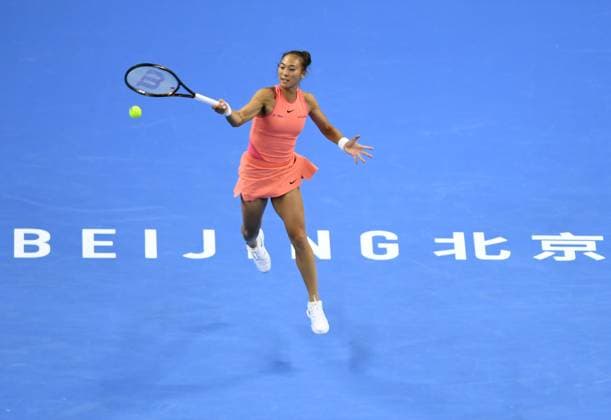(240930) -- BEIJING, Sept. 30, 2024 -- Zheng Qinwen of China hits a return during the women s singles 3rd round match against Nadia Podoroska of Argentina at 2024 China Open tennis tournament in Beijing, capital of China, Sept. 30, 2024. ) (SP)CHINA-BEIJING-TENNIS-CHINA OPEN-WOMEN S SINGLES (CN) ZhangxChenlin 