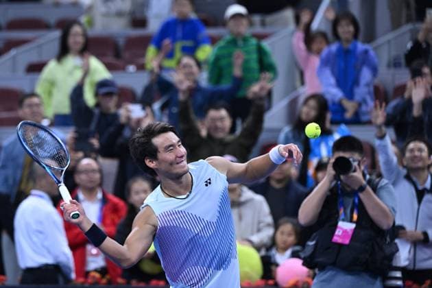 (240930) -- BEIJING, Sept. 30, 2024 -- Bu Yunchaokete presents the autographed ball to the crowd after the men s singles quarterfinal between Bu Yunchaokete of China and Andrey Rublev of Russia at 2024 China Open tennis tournament in Beijing, capital of China, Sept. 30, 2024. ) (SP)CHINA-BEIJING-TENNIS-CHINA OPEN-MEN S SINGLES (CN) ZhangxLong 