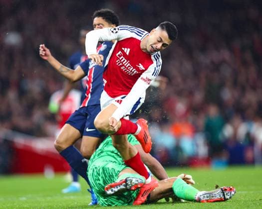 Arsenal v PSG 1 October 2024, London - UEFA Champion™s League Football - Arsenal v Paris Saint-Germain - Gabriel Martinelli of Arsenal is tripped by Paris Saint Germain goalkeeper Gianluigi Donnarumma - Photo: Charlotte Wilson Offside. London UK Copyright: xCharlottexWilsonx xOffsidexOffside
