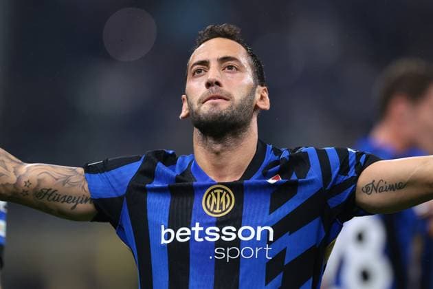 Milan, Italy, 1st October 2024. Hakan Calhanoglu of FC Internazionale celebrates after scoring to give the side a 1-0 lead during the UEFA Champions League match at Giuseppe Meazza, Milan. Picture credit should read: Jonathan Moscrop Sportimage EDITORIAL USE ONLY. No use with unauthorised audio, video, data, fixture lists, club league logos or live services. Online in-match use limited to 120 images, no video emulation. No use in betting, games or single club league player publications. SPI-3339-0018