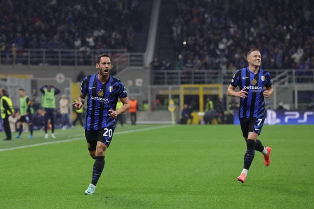 Milan, Italy, 1st October 2024. Hakan Calhanoglu of FC Internazionale celebrates with team mate Piotr Zielinski after scoring to give the side a 1-0 lead in the UEFA Champions League match at Giuseppe Meazza, Milan. Picture credit should read: Jonathan Moscrop Sportimage EDITORIAL USE ONLY. No use with unauthorised audio, video, data, fixture lists, club league logos or live services. Online in-match use limited to 120 images, no video emulation. No use in betting, games or single club league player publications. SPI-3339-0021