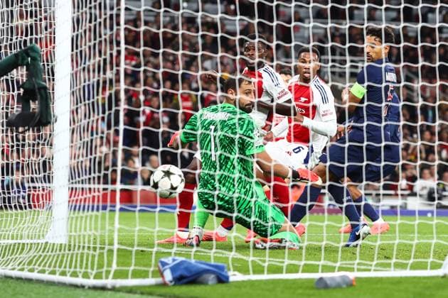 Arsenal v PSG 1 October 2024, London - UEFA Champion™s League Football - Arsenal v Paris Saint-Germain - Thomas Partey of Arsenal and Marquinhos of Paris Saint Germain watch the ball go past Paris Saint Germain goalkeeper Gianluigi Donnarumma for the second Arsenal goal scored by Bukayo Saka - Photo: Charlotte Wilson Offside. London UK Copyright: xCharlottexWilsonx xOffsidexOffside