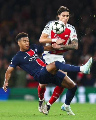 Arsenal v PSG 1 October 2024, London - UEFA Champion™s League Football - Arsenal v Paris Saint-Germain - Riccardo Calafiori of Arsenal and Desire Doue of Paris Saint Germain - Photo: Charlotte Wilson Offside. London UK Copyright: xCharlottexWilsonx xOffsidexOffside