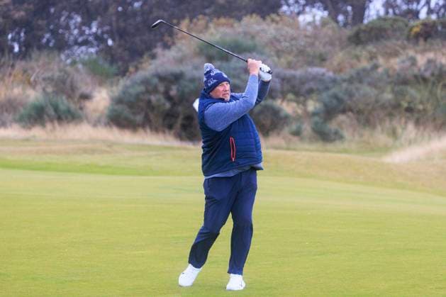 1st October 2024; Kingsbarns Golf Links, Fife, Scotland; Alfred Dunhill Links Golf Championship, Second Practice Day; Former England cricketer Ian Botham hits a shot from the fairway on the first hole at Kingsbarns Golf Links, during a practice round ahead of the Dunhill Links Championship  ActionPlus12698731 DavidxYoung
