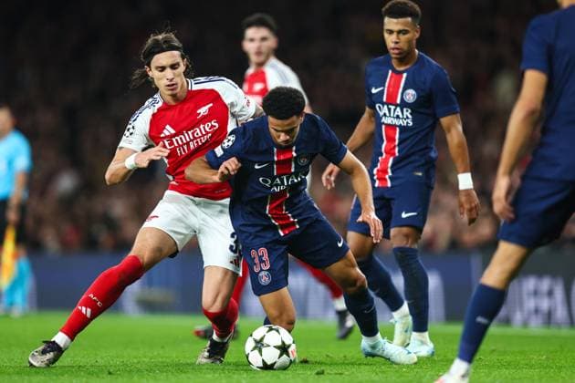 Arsenal v PSG 1 October 2024, London - UEFA Champion™s League Football - Arsenal v Paris Saint-Germain - Riccardo Calafiori of Arsenal and Warren Zaire-Emery of Paris Saint Germain - Photo: Charlotte Wilson Offside. London UK Copyright: xCharlottexWilsonx xOffsidexOffside