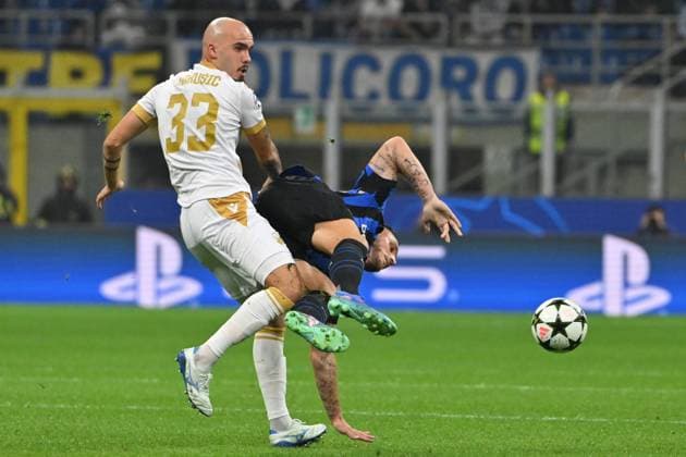 1st October 2024; Stadio San Siro, Milan, Italy, UEFA Champions League Football, Inter Milan versus Red Star Belgrade; Vanja Drkusic of Red Star upends Marko Arnautovic of FC Inter  ActionPlus12698788 AllShotLive