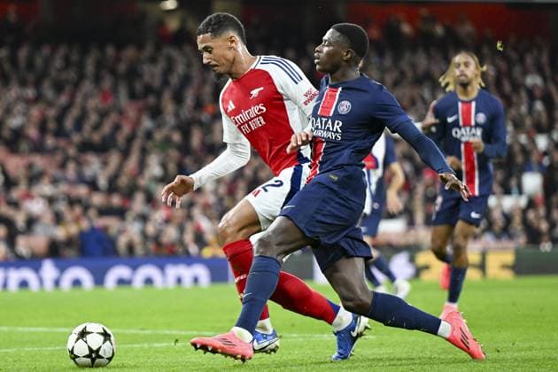 LONDON, ENGLAND - OCTOBER 1: Nuno Mendes of Paris Saint Germain (R) is challenged by William Saliba of Arsenal (L) during the UEFA Champions League 2024 25 League Phase MD2 match between Arsenal FC and Paris Saint-Germain at Emirates Stadium on October 1, 2024 in London, England. (Photo by Will Palmer SPP) FOOTBALL : Arsenal Vs Paris Saint-Germain - Ligue des Champions - 01 10 2024 LiamAmsan Panoramic 