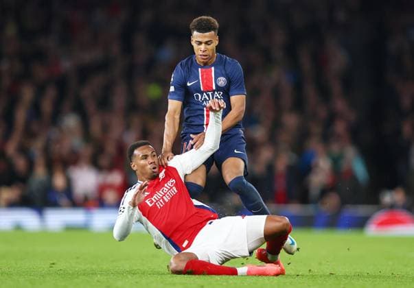 Arsenal v PSG 1 October 2024, London - UEFA Champion™s League Football - Arsenal v Paris Saint-Germain - Desire Doue of PSG and Gabriel of Arsenal collide - Photo: Charlotte Wilson Offside. London UK Copyright: xCharlottexWilsonx xOffsidexOffside