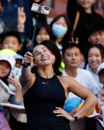 (241002) -- BEIJING, Oct. 2, 2024 -- Aryna Sabalenka of Belarus takes selfies after winning the Women s Singles Round of 16 match between Aryna Sabalenka of Belarus and Madison Keys of the United States at the 2024 China Open tennis tournament in Beijing, capital of China, Oct. 2, 2024. ) (SP)CHINA-BEIJING-TENNIS-CHINA OPEN-WOMEN S SINGLES (CN) WangxLili 