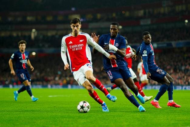 Kai Havertz of Arsenal and William Pacho of PSG Arsenal v Paris Saint-Germain, UEFA Champions League, Group Stage, Football, Emirates Stadium, London, UK, 01 Oct 2024 EDITORIAL USE ONLY No use with unauthorised audio, video, data, fixture lists, club league logos or live services. Online in-match use limited to 120 images, no video emulation. No use in betting, games or single club league player publications.  Copyright: xJavierxGarcia Shutterstockx 14750159bp