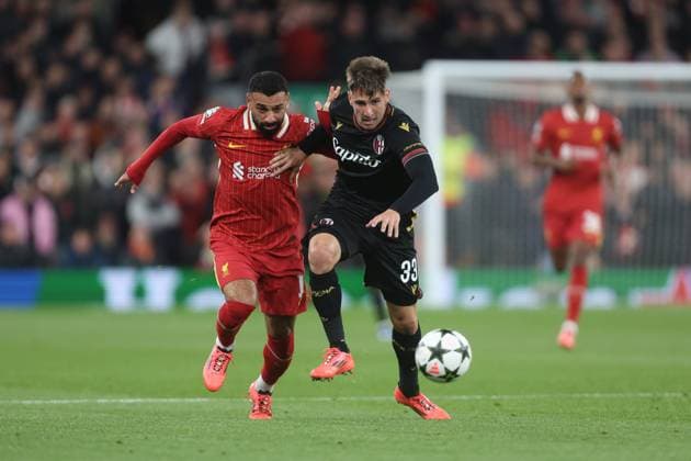Mohamed Salah of Liverpool and Juan Miranda of Bologna Liverpool v Bologna, UEFA Champions League, Group Stage, Football, Anfield, Liverpool, UK, 02 Oct 2024 EDITORIAL USE ONLY No use with unauthorised audio, video, data, fixture lists, club league logos or live services. Online in-match use limited to 120 images, no video emulation. No use in betting, games or single club league player publications.  Copyright: xPhilxOldham Shutterstockx 14750771r