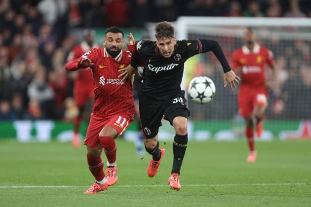 Mohamed Salah of Liverpool and Juan Miranda of Bologna Liverpool v Bologna, UEFA Champions League, Group Stage, Football, Anfield, Liverpool, UK, 02 Oct 2024 EDITORIAL USE ONLY No use with unauthorised audio, video, data, fixture lists, club league logos or live services. Online in-match use limited to 120 images, no video emulation. No use in betting, games or single club league player publications.  Copyright: xPhilxOldham Shutterstockx 14750771q