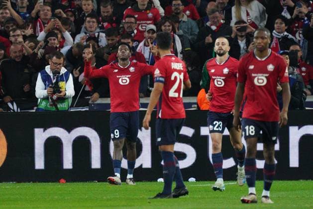 Jonathan David of Lille celebrates after he puts his side 1-0 ahead with a penalty following an intervention by VAR Lille v Real Madrid, UEFA Champions League, Group Stage, Football, Pierre Mauroy Stadium, Lille, France, 02 Oct 2024 EDITORIAL USE ONLY No use with unauthorised audio, video, data, fixture lists, club league logos or live services. Online in-match use limited to 120 images, no video emulation. No use in betting, games or single club league player publications. Copyright: xDavexWinter Shutterstockx 14750773az