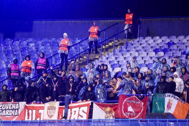 GNK Dinamo v AS Monaco - UEFA Champions League 2024 25 League Phase MD2 ZAGREB, CROATIA - OCTOBER 2: Fans cheer on a heavy rain during UEFA Champions League 2024 25 League Phase MD2 match between GNK Dinamo v AS Monaco at Maksimir Stadion on October 2, 2024 in Zagreb, Croatia.  LukaxStanzl PIXSELL