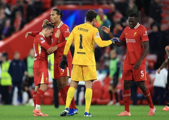 Liverpool, England, 2nd October 2024. (L-R) Kostas Tsimikas, Virgil van Dijk, Alisson Becker and Ibrahima Konatà of Liverpool celebrate after the UEFA Champions League match at Anfield, Liverpool. Picture credit should read: Jessica Hornby Sportimage EDITORIAL USE ONLY. No use with unauthorised audio, video, data, fixture lists, club league logos or live services. Online in-match use limited to 120 images, no video emulation. No use in betting, games or single club league player publications. SPI-3353-0046