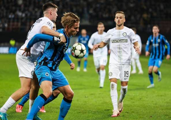 SOCCER - UEFA CL, Sturm vs Brugge KLAGENFURT,AUSTRIA,02.OCT.24 - SOCCER - UEFA Champions League, SK Sturm Graz vs Club Brugge. Image shows Max Johnston (Sturm) and Romeo Vermant (Club Brügge).  GEPAxpictures xWolfgangxGrebien