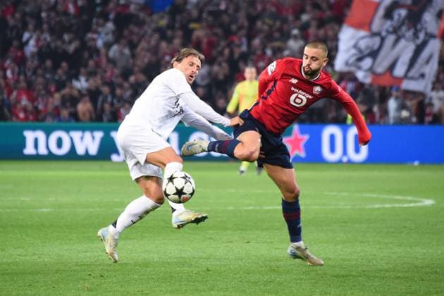 Luka Modric ( 10 - Real Madrid ) and Edon ZHEGROVA ( 23 - Lille ) during the UEFA Champions League match between Lille OSC and Real Madrid CF at Stade Pierre Mauroy on October 02, 2024 in Lille, France. ( Photo by federico pestellini panoramic ) - FOOTBALL : Lille vs Real Madrid - Ligue des Champions - 02 10 2024 FedericoPestellini Panoramic 