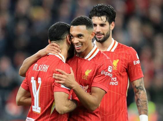 2nd October 2024; Anfield, Liverpool, Merseyside, England; Champions League Football, Liverpool versus Bologna; Mohammed Salah of Liverpool is congratulated by team mate Trent Alexander-Arnold after scoring for 2-0 in the 75th minute  ActionPlus12699236 DavidxBlunsden
