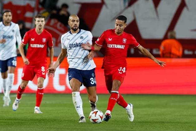 Anass Salah-Eddine of FC Twente and Sofyan Amrabat of Fenerbahce battle for the ball , UEFA Europa League 2024 25 League Phase MD2, FC Twente v Fenerbahce SK, De Grolsch Veste, October 3, 2024, Enschede, Netherlands.