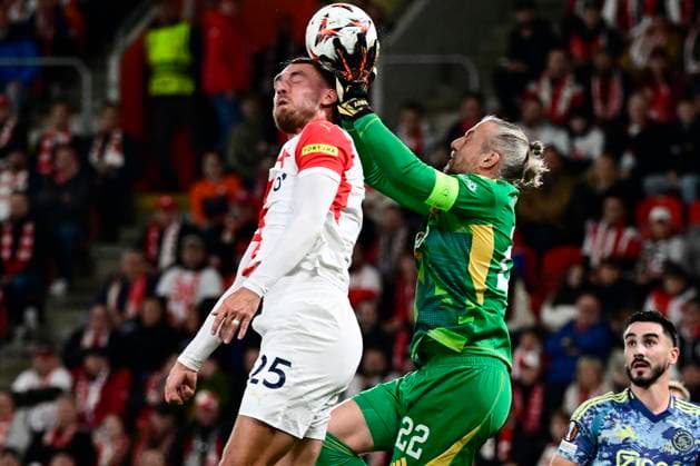 L-R Tomas Chory (Slavia) and goalkeeper Remko Pasveer (Ajax) in action during the Football Europa League 2nd round match SK Slavia Prague vs Ajax Amsterdam in Prague, Czech Republic, October 3, 2024. (CTKxPhoto OndrejxDeml) CTKPhotoP2024100308017  CTKPhotoP2024100308017