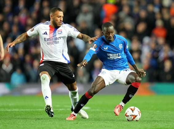 Rangers Mohammed Diomandel and Corentin Tolisso of Olympique Lyonnais during the UEFA Europa League match between Rangers FC and Olympique Lyonnais at Ibrox Stadium, Glasgow on 3rd October, 2024. Rangers v Lyon, UEFA Europa League, Group Stage, Football, Ibrox Stadium, Glasgow, Scotland, UK, 03 Oct 2024 EDITORIAL USE ONLY No use with unauthorised audio, video, data, fixture lists, club league logos or live services. Online in-match use limited to 120 images, no video emulation. No use in betting, games or single club league player publications. Copyright: xMarkxRunnacles Shutterstockx 14750818aw