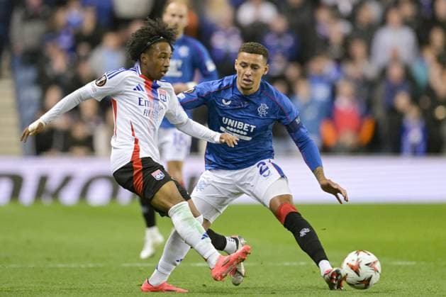 GLASGOW, SCOTLAND - OCTOBER 3: James Tavernier of Rangers FC (R) fights for the ball with Malick Fofana of Olympique Lyon (L) during the UEFA Europa League 2024 25 League Phase Matchday 2 match between Rangers FC and Olympique Lyonnais at Ibrox Stadium on October 03, 2024 in Glasgow, Scotland. FOOTBALL : Glasgow Rangers Vs Olympique Lyonnais - Ligue Europa - 03 10 2024 RichardCallis Panoramic 