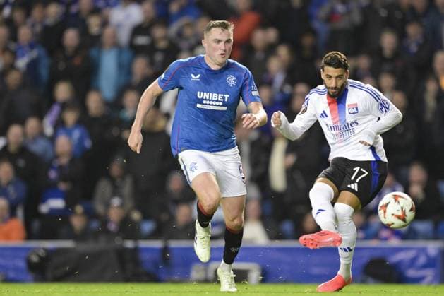 GLASGOW, SCOTLAND - OCTOBER 3: John Souttar of Rangers FC (L) chases the ball during the UEFA Europa League 2024 25 League Phase Matchday 2 match between Rangers FC and Olympique Lyonnais at Ibrox Stadium on October 03, 2024 in Glasgow, Scotland. FOOTBALL : Glasgow Rangers Vs Olympique Lyonnais - Ligue Europa - 03 10 2024 RichardCallis Panoramic 
