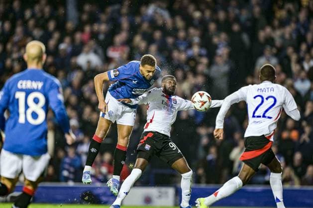 GLASGOW, SCOTLAND - OCTOBER 3: Cyriel Dessers of Rangers and Ainsley Maitland-Niles of Lyon during the UEFA Europa League 2024 25 League Phase Matchday 2 match between Rangers FC and Olympique Lyonnais at Ibrox Stadium on October 03, 2024 in Glasgow, Scotland. FOOTBALL : Glasgow Rangers Vs Olympique Lyonnais - Ligue Europa - 03 10 2024 RichardCallis Panoramic 