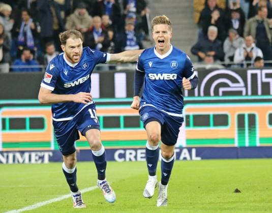 04.10.2024, xmohx, Fussball 2.Bundesliga, Karlsruher SC - SV Darmstadt 98 emspor, v.l. Budu Zivzivadze und Dzenis Burnic (karslruhe) bejubeln das 1-0 (DFL DFB REGULATIONS PROHIBIT ANY USE OF PHOTOGRAPHS as IMAGE SEQUENCES and or QUASI-VIDEO) Karlsruhe