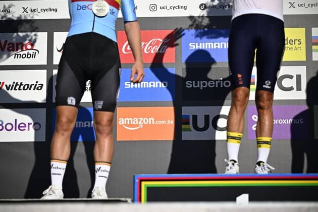 The legs of second placed Belgian Lotte Kopecky and winner Dutch Marianne Vos pictured on the podium after the women elite race at the UCI World Gravel Championships, Saturday 05 October 2024, in Leuven. JASPERxJACOBS  x101964103x