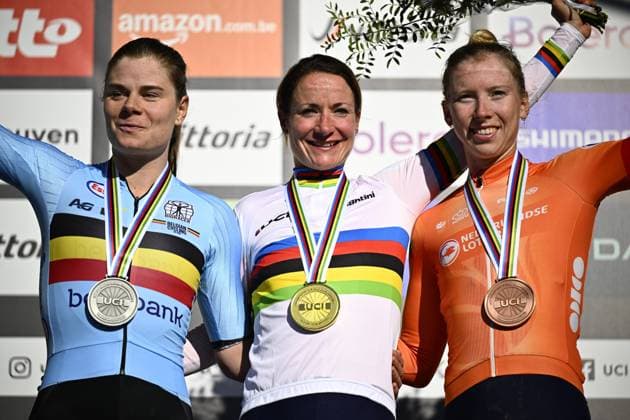 Belgian Lotte Kopecky, Dutch Marianne Vos and Dutch Wiebes Lorena celebrate on the podium after the women elite race at the UCI World Gravel Championships, Saturday 05 October 2024, in Leuven. JASPERxJACOBS  x101964348x